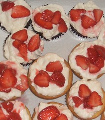 strawberries on choc and vanilla cupcakes